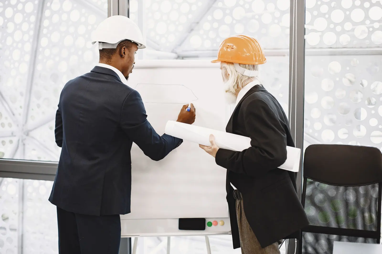 Two architects reviewing a plan before anything is built