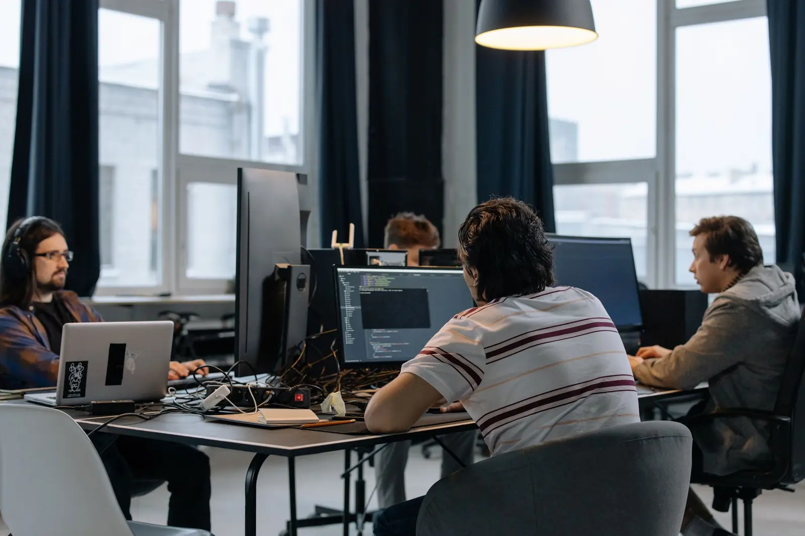An in-house engineering team at work in an open office